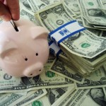 Putting_money_into_a_piggybank
